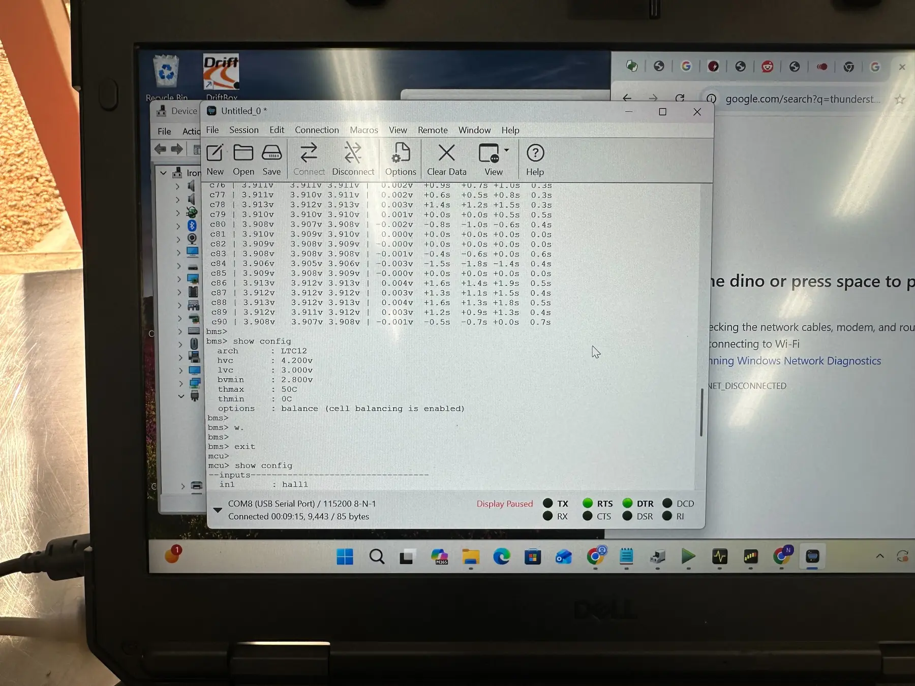 Serial terminal showing individual BMS cell-group voltage readings and configuration values