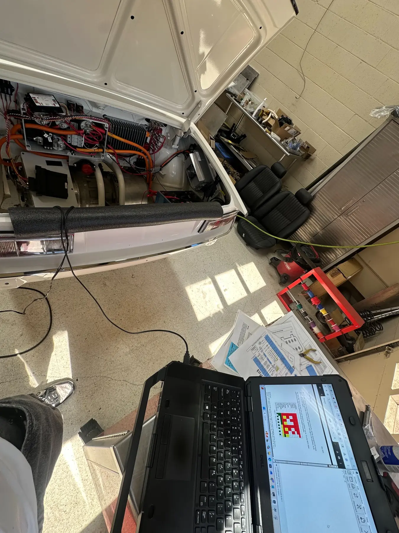 Laptop connected to the vehicle during a battery-management-system configuration session