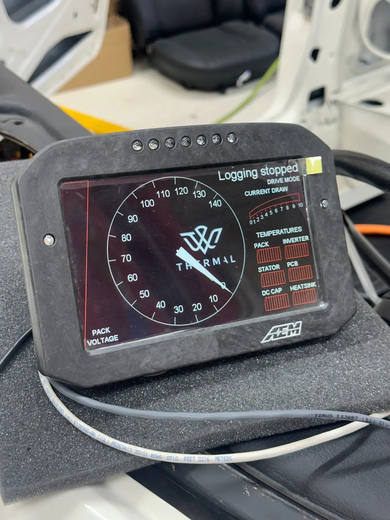Early AEM dash interface displaying initial speed and status graphics