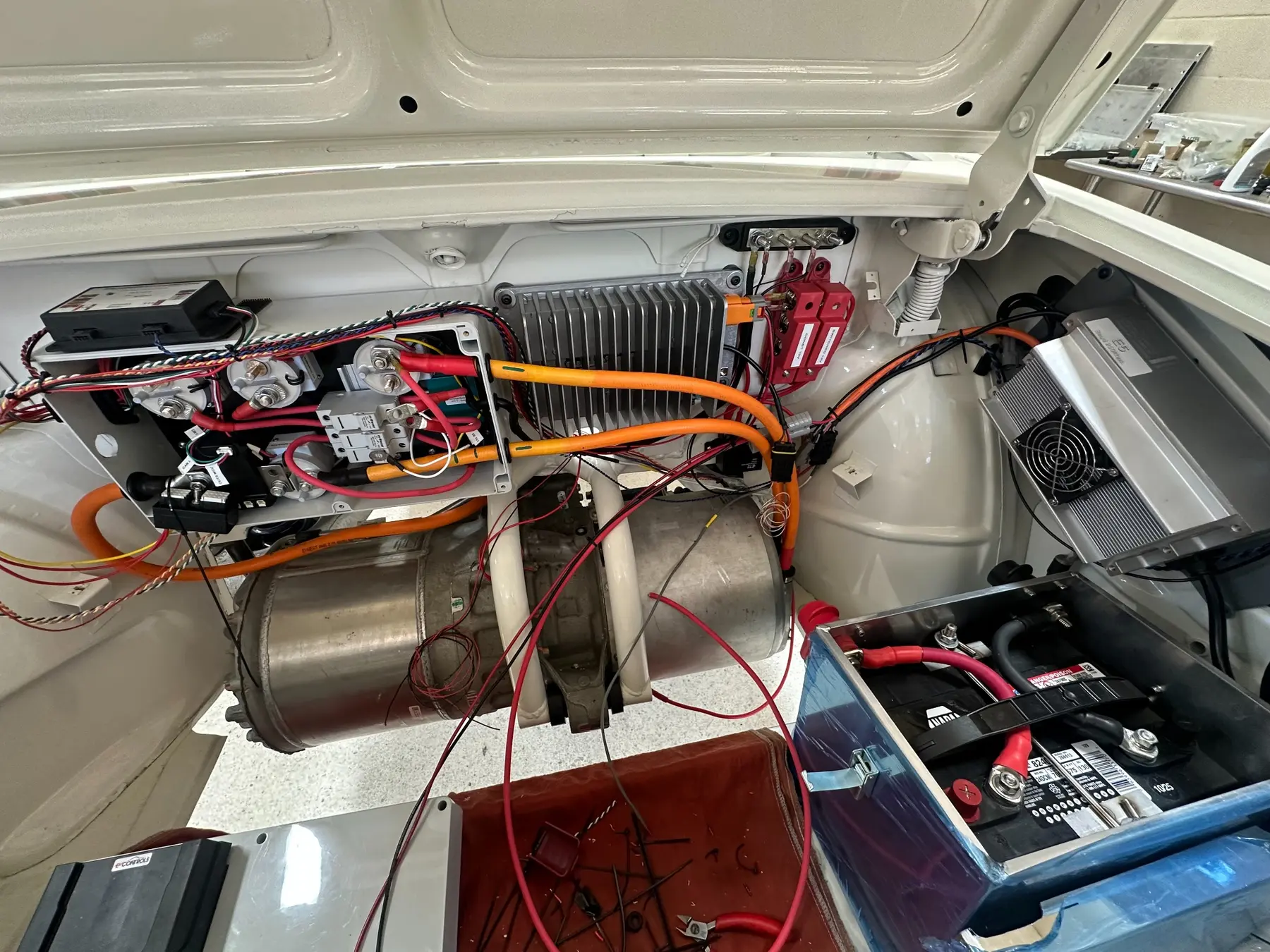 Front systems bay with high-voltage cabling, controls, and auxiliary electronics during integration