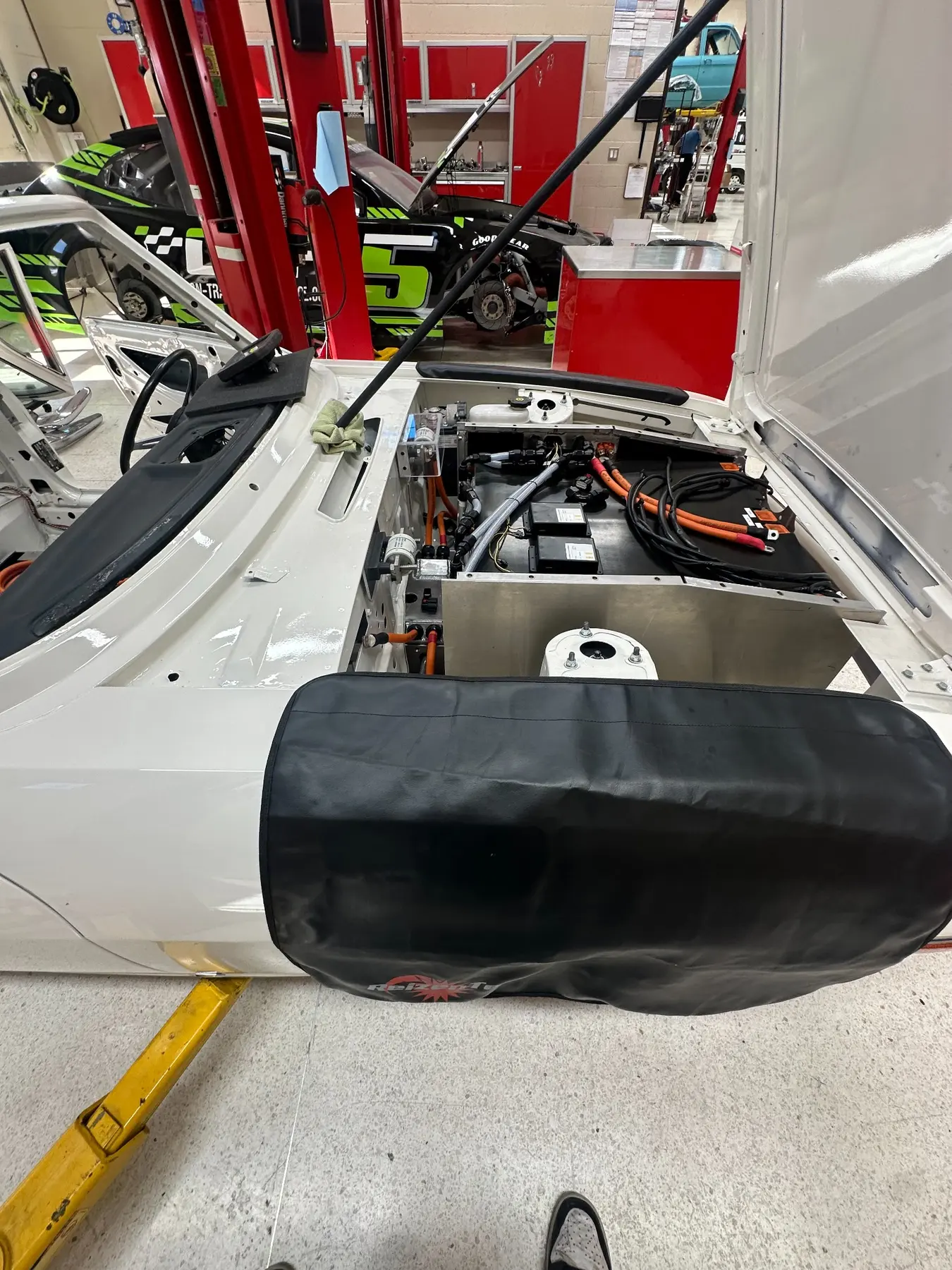 Vehicle systems bay with integrated high-voltage and low-voltage hardware